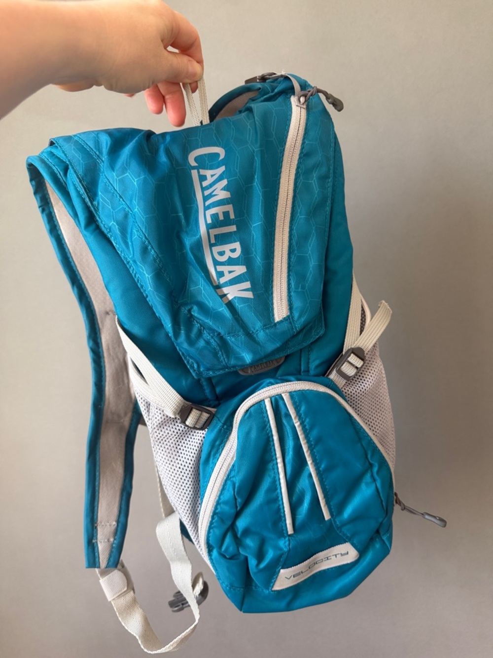 Camelbak teal and white hydration backpack